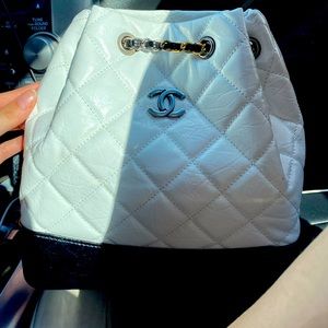 It’s a white chanel leather back pack